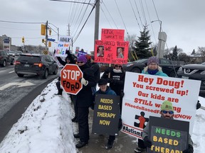 Parents of children with autism rallied outside MPP Jeremy Roberts's Merivale Road constituency office Sunday to lobby the provincial government to deliver needs-based services on January 5, 2020