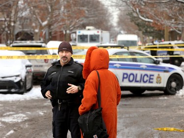 Gilmour Street resident Kacey Griffiths (right) tries to get back into her home following the shooting. She was an eyewitness at the scene, seeing young people being taken away in stretchers from what she believes is an airbnb unit beside her home.  Gilmour Street near Kent remained blocked off by police Wednesday (Jan. 8, 2020) morning following a shooting that left one person dead and three more in hospital - including a 15-year-old boy at CHEO.