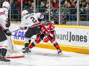 Ottawa 67's Jack Quinn working hard trying to make a shot against the Owen Sound Attack.