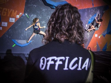 The finals for the 2020 CEC Open Boulder Nationals were held Sunday at Altitude climbing gym in Kanata. Sophie Buitendyk of British Colombia and Nathan Smith of Quebec both try to climb their problems as officials watch on.