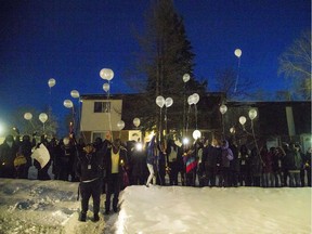 Balloons were released after a vigil was held for Manny Akol, Sunday Jan. 19, 2020, at the Michele Heights Community Centre.