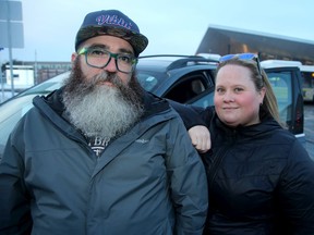 Jamie Chapman works in Hull and his wife Melanie works downtown. The pair, who live in Hintonburg, were spending $232 dollars on transit passes before and now pay $195 for a parking spot. Taking the car to work is cheaper and easier, they say. And they're especially thrilled they don't have to deal with the recent LRT mess.