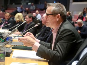 Peter Lauch, chief executive of Rideau Transit Maintenance, answers questions at an emergency transit commission meeting Thursday, January 23, 2020.