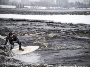 A couple experienced surfers, including Magalie Rondeau, pulled on their wetsuits, packed some thermos' of hot drinks and got together to enjoy the Sewer Wave on the Ottawa River, along the Gatineau shore.
