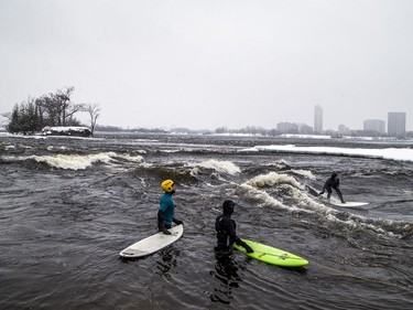 You don't see this every day. Surfers on the Ottawa River ... especially in the middle of winter.