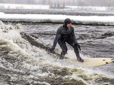 A couple experienced surfers, including Magalie Rondeau demonstrated their surfing skills on the Ottawa River on Sunday.