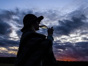 Rockstars, chefs, and farmers had a back-to-nature evening of fun Sunday, Sept. 15, at the Tunes for Spoons event at the Klotz Farm in Farrellton, Que. Erica McNaughton Leslie takes a sip of her bubbly as the sun set over the farm.