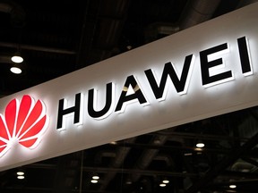 This file photo from Aug. 2, 2019, shows the Huawei logo at the Consumer Electronics Expo in Beijing.