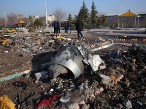 Rescue teams work amid debris after a Ukrainian plane carrying 176 people crashed near Imam Khomeini airport in the Iranian capital Tehran early in the morning on January 8, 2020, killing everyone on board.