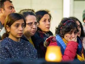 A woman weeps during a memorial service at Western University in London, Ont. on Jan. 8, 2020.