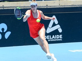 Gabriela Dabrowski of Canada hits a return against Daria Kasatkina of Russia during their first session women's singles match on day one of the ATP Cup Adelaide International tennis tournament in Adelaide on January 12, 2020.