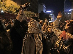 Lebanese demonstrators chant slogans as they gather in front of the central bank headquarters in the capital Beirut on January 15, 2020,(Photo by ANWAR AMRO / AFP)