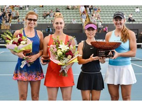 Second place winners  Gabriela Dabrowski (2nd from the left) and Croatia's Darija Jurak (left) along side trophy winners, Xu Yifan of China (2nd from the right) and Nicole Melichar of the U.S. (right) at the Adelaide International tennis tournament on Friday.