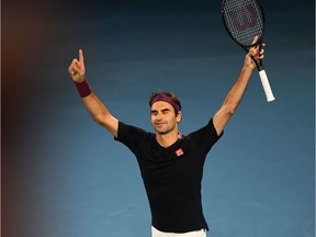 Switzerland's Roger Federer celebrates after victory against Australia's John Millman during their men's singles match on day five of the Australian Open tennis tournament in Melbourne on January 24, 2020.