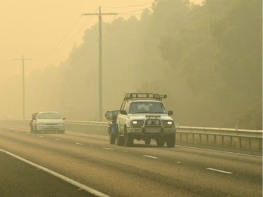 Cars are seen evacuating from Lakes Entrance prior to the road closure along the Princes Highway outside Bairnsdale, Victoria, Australia, January 4, 2020.