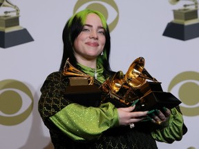 Billie Eilish poses backstage with her awards to include Song of the Year for "Bad Guy" , Best New Artist, and Album of the Year for  "When We All Fall Asleep, Where Do We Go?".