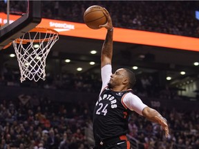 Raptors guard Norman Powell soars to the hoop for two points against the 76ers in Toronto on Wednesday night.