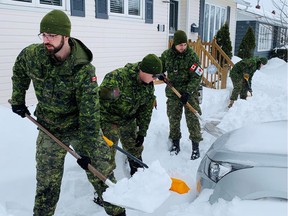 Canadian Forces members help residents with snow removal as the country's eastern province recovers from last week's massive blizzard, prompting several towns to declare their first state of emergency in more than three decades, in St. John's, Newfoundland and Labrador, Canada January 20, 2020.