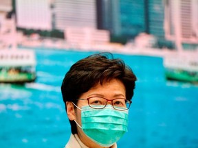 Files: Hong Kong Chief Executive Carrie Lam wears a mask, following the outbreak of a new coronavirus, during a news conference in Hong Kong, China January 31, 2020.