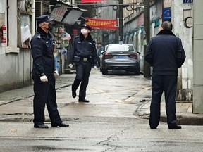 Police patrol a neighbourhood in Wuhan, China, on Jan. 22, 2020 amid a coronavirus outbreak.