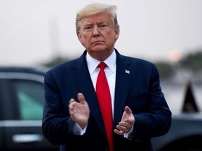 U.S. President Donald Trump disembarks from Air Force One upon arrival at Miami International Airport in Miami, Fla., on Thursday, Jan. 23, 2020.