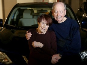 Elliot Berman, 88, and his wife Marjorie, 85, stand in front of their recently-repaired car at their Kanata home.  Mr Berman had his car damaged while going through a car wash recently.