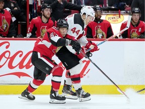 Ottawa Senators right wing Tyler Ennis battles with New Jersey Devils left wing Miles Wood at the Canadian Tire Centre, Dec. 29, 2019.