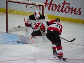 Files: New Jersey Devils goalie Mackenzie Blackwood makes a save on a shot from Ottawa Senators right wing Connor Brown in January, 2020.