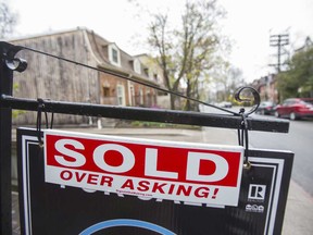 "Sold, over asking" housing sign in Toronto, Ontario