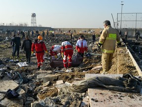 Rescue workers recover two more bodies in the wreckage of a Boeing Co. 737-800 aircraft, operated by Ukraine International Airlines, which crashed shortly after takeoff near Shahedshahr, Iran, on Wednesday, Jan. 8, 2020.
