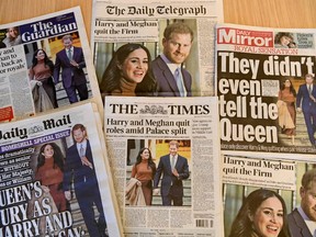 An arrangement of U.K. daily newspapers photographed as an illustration in London on January 9, 2020, shows front page headlines reporting on the news that Britain's Prince Harry, Duke of Sussex and his wife Meghan, Duchess of Sussex, plan to step back as "senior" members of the Royal Family