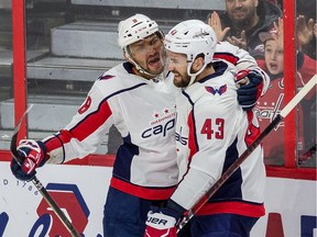 The Washington Capitals' Alex Ovechkin celebrates a goal against the Ottawa Senators with teammate Tom Wilson at the Canadian Tire Centre on Friday, Jan. 31, 2020.