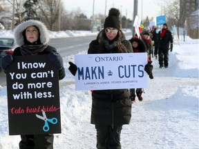 Teachers were on the picket lines at Catholic schools Tuesday.