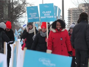 Ottawa catholic teachers walk the picket line at St. Pat's High School in Ottawa Tuesday Jan 21, 2020. Mitzie Hunter (red jacket),  MPP for Scarborough-Guildwood, walks the line with the Ottawa teachers Tuesday.