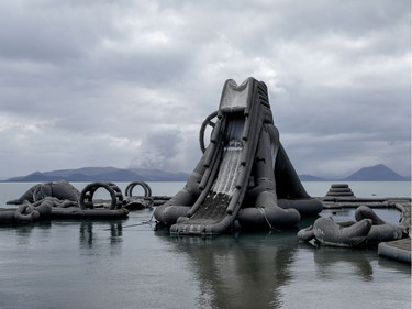 Inflatables floating on Taal Lake are covered with volcanic ash in a resort near the erupting Taal Volcano in Talisay, Batangas, Philippines, January 14, 2020.