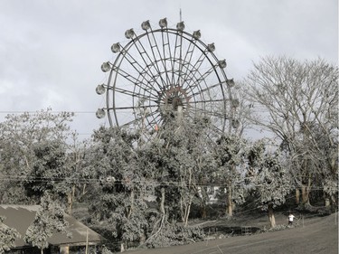 A ferris wheel is covered with volcanic ash in a park in Tagaytay City, Philippines, January 14, 2020.