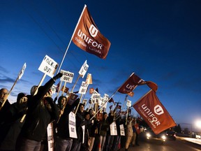 Members of Unifor Local 594 hold signs during a rally outside the Co-op Refinery in Regina on Thursday December 5, 2019. The union representing hundreds of Regina Co-op refinery workers is asking Unifor locals from across Canada to send members out to Saskatchewan as a show of solidarity.