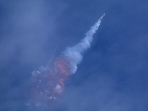 A SpaceX Falcon 9 rocket engine self-destructs after jettisoning the Crew Dragon astronaut capsule during an in-flight abort test, a key milestone before flying humans in 2020 under NASA's commercial crew program, after lift off from the Kennedy Space Center in Cape Canaveral, Florida, U.S. January 19, 2020. REUTERS/Joe Rimkus Jr ORG XMIT: TOR522