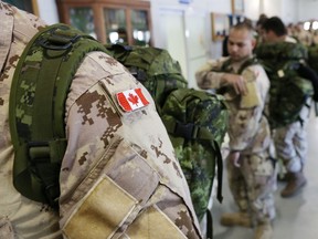 Some of the 104 troops from various Canadian Armed Forces bases who will serve in Iraq in 2014.