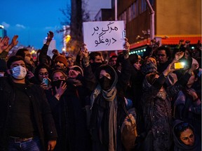 Demonstrators chant while gathering during a vigil for the victims of the Ukraine International Airlines flight that was unintentionally shot down by Iran, in Tehran, Iran, on Saturday, Jan. 11, 2019. Iran admitted it unintentionally shot down a Ukrainian jetliner that it mistook for a cruise missile, a dramatic reversal after days of denials that triggered international condemnation and protests in the streets of Tehran.