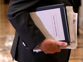 Sen. Patrick Leahy (D-VT) carries paperwork as he exits the Senate chamber after the third day of the Senate impeachment trial of U.S. President Donald Trump at the U.S. Capitol in Washington, U.S., January 23, 2020.
