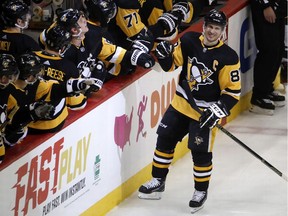 Pittsburgh Penguins' Sidney Crosby (87) returns to the bench after his goal during the third period of an NHL hockey game against the Minnesota Wild in Pittsburgh, Tuesday, Jan. 14, 2020.
