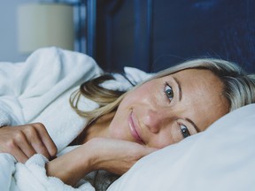 FILE: A woman in bed.