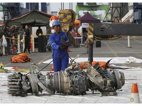 An engine recovered from the Boeing 737 MAX 8 Lion Air jet is investigated in Jakarta, Indonesia, Nov. 4, 2018. The crash marks the third time in 15 months that a Boeing jet has been involved in a fatal crash minutes after takeoff.