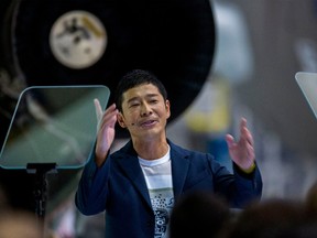 Japanese billionaire Yusaku Maezawa speaks near a Falcon 9 rocket during the announcement by Elon Musk to be the first private passenger who will fly around the Moon aboard the SpaceX BFR launch vehicle, at the SpaceX headquarters and rocket factory on September 17, 2018 in Hawthorne, California.