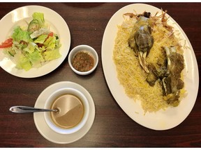 Lamb mandi, lamb broth, salad, spicy dip at Bukhari