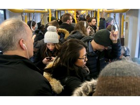 The crowded ride on the LRT train from Tunney's Pasture going east.