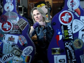 Local singer-songwriter Lynne Hanson, sitting between her well-travelled guitar cases,  recently released her new album "Just Words" and will be playing at the Centrepointe Theatre on February 21st.