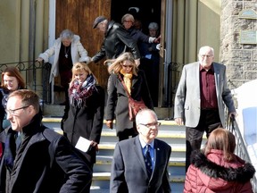 Mourners leave church after funeral services for Jeannette Runciman.