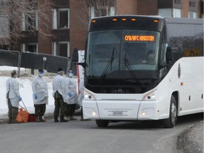 Several army personnel could be seen with medical gowns and masks, on Friday February 21, 2020 in Cornwall, Ont.